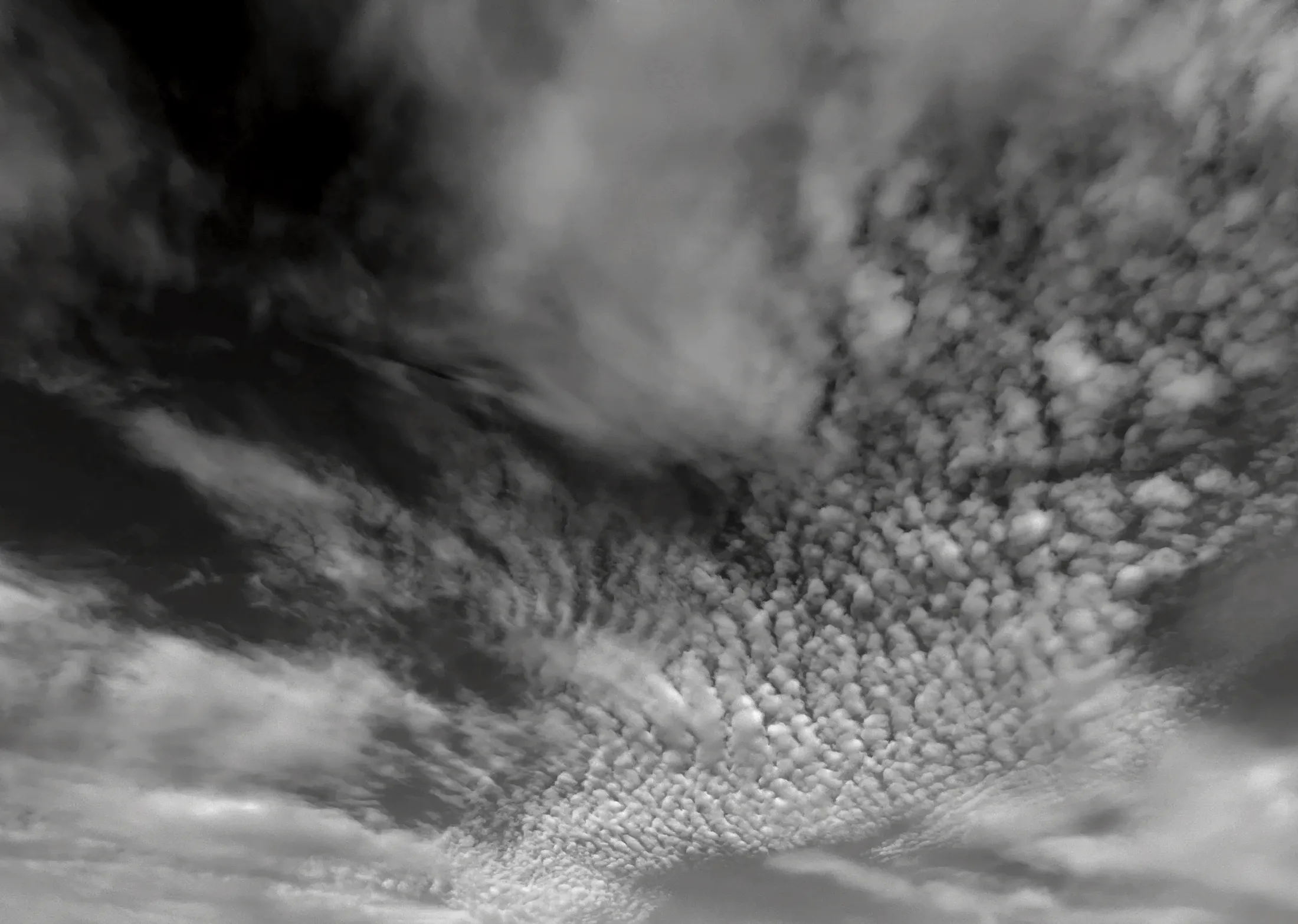 Rippled clouds across a dark Manitoba sky